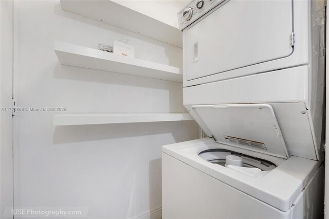 laundry area with stacked washer / drying machine