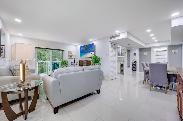 living room with beverage cooler and light tile patterned floors