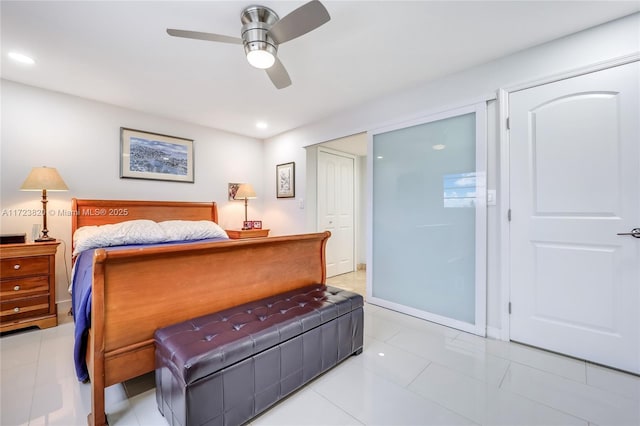 bedroom with light tile patterned flooring and ceiling fan