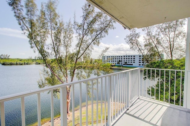 balcony featuring a water view