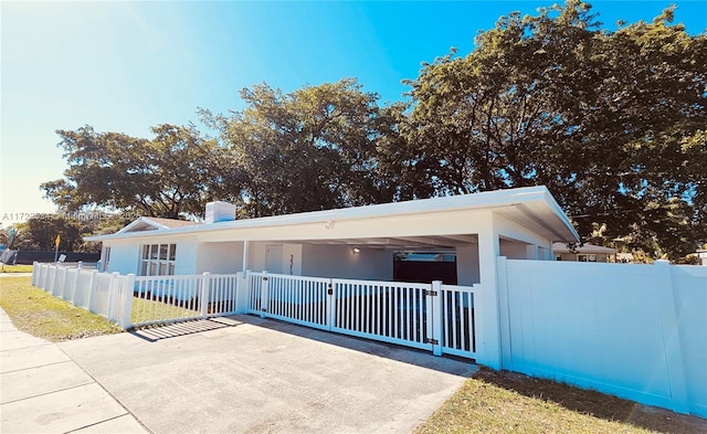 view of front of house featuring a carport and a porch