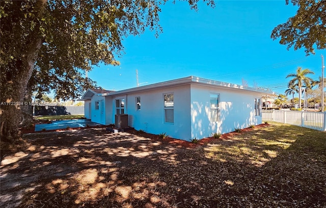 rear view of house with central air condition unit