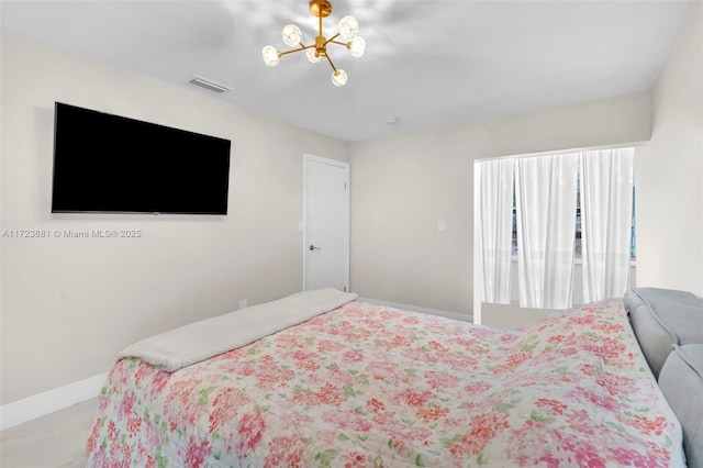 bedroom with an inviting chandelier