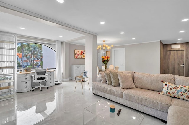 living room with ornamental molding and a chandelier