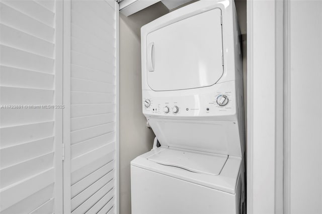 laundry room with stacked washer and clothes dryer