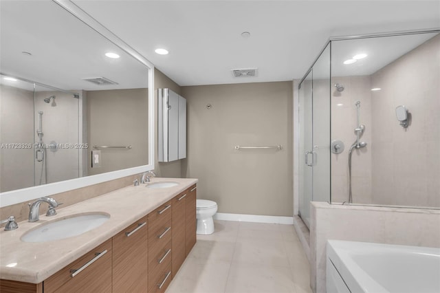 full bathroom with plus walk in shower, tile patterned floors, vanity, and toilet