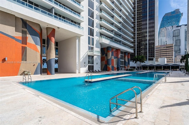 view of swimming pool featuring a patio