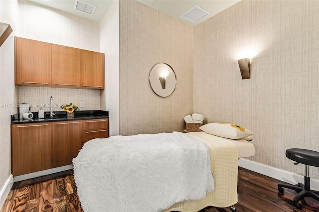 bedroom with dark wood-type flooring