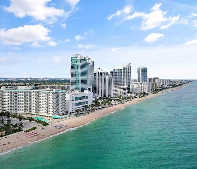 bird's eye view with a view of the beach and a water view