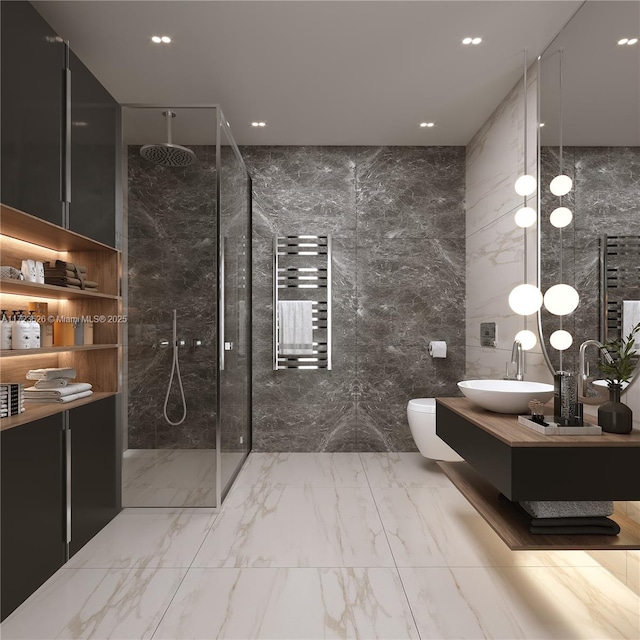 bathroom with toilet, a shower, tile walls, and vanity