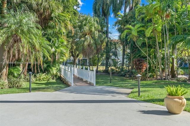 view of gate featuring a yard