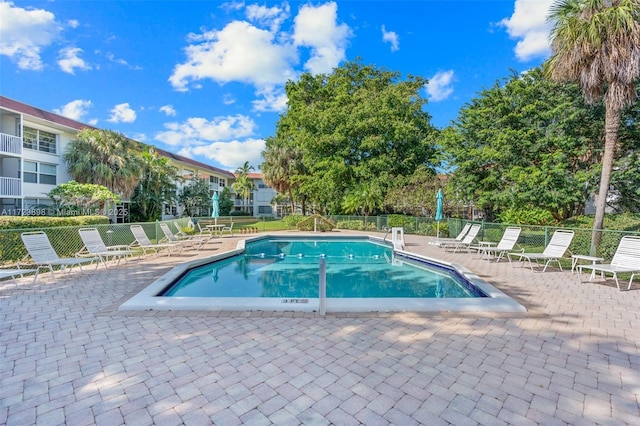 view of swimming pool with a patio