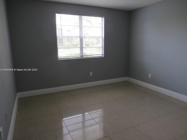 view of tiled spare room