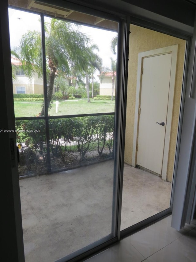 doorway featuring light tile patterned floors