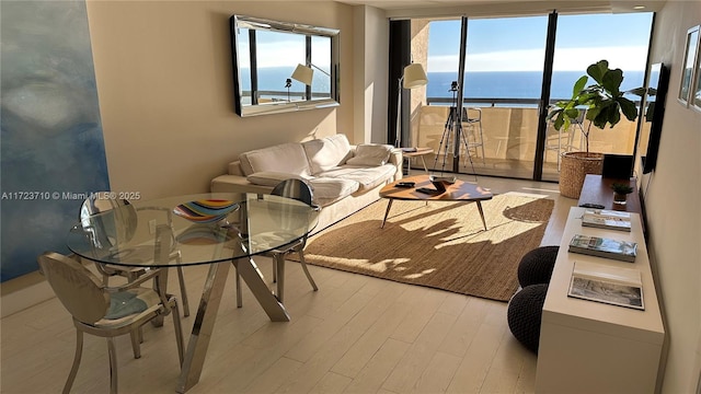 living room with floor to ceiling windows and light hardwood / wood-style flooring