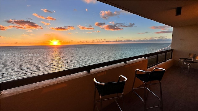 balcony at dusk with a water view