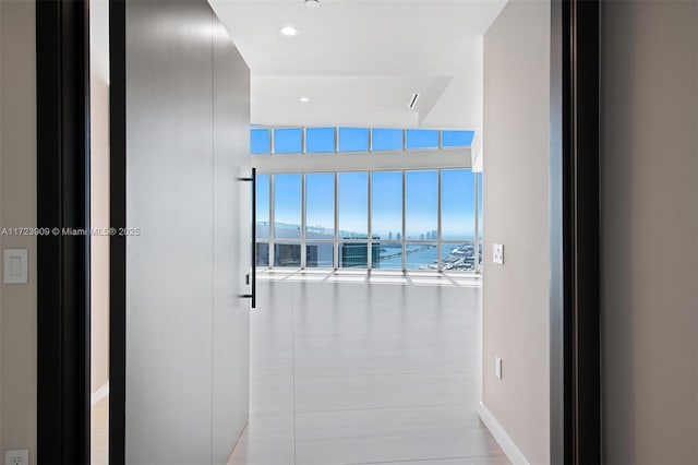 hallway featuring floor to ceiling windows