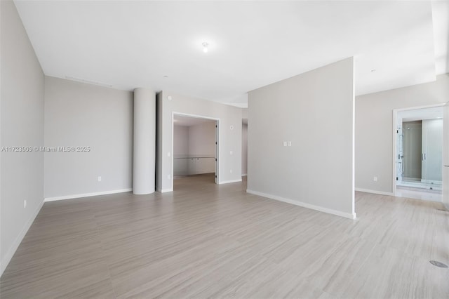 spare room with light wood-type flooring