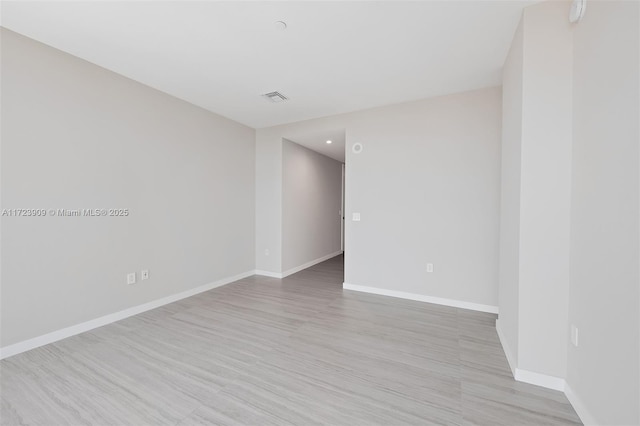 empty room with light wood-type flooring