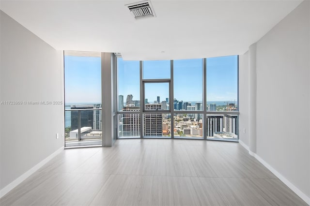 empty room with floor to ceiling windows