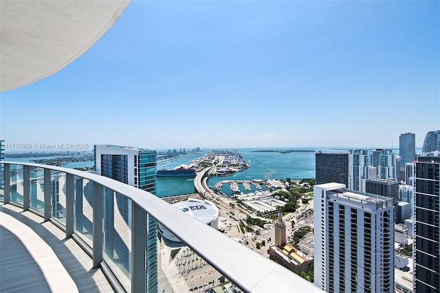 balcony featuring a water view