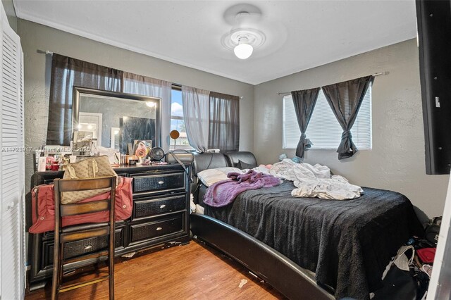 bedroom with hardwood / wood-style flooring