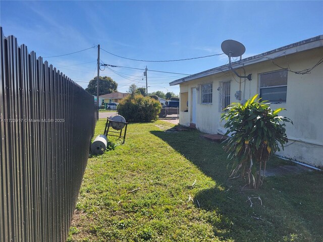 bungalow-style house with a patio, central AC, and a front yard