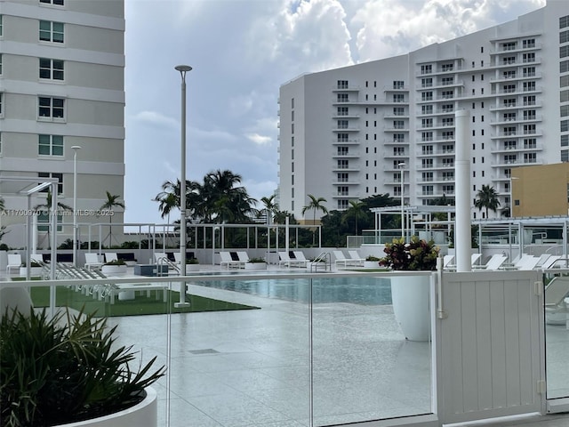 view of swimming pool with a patio