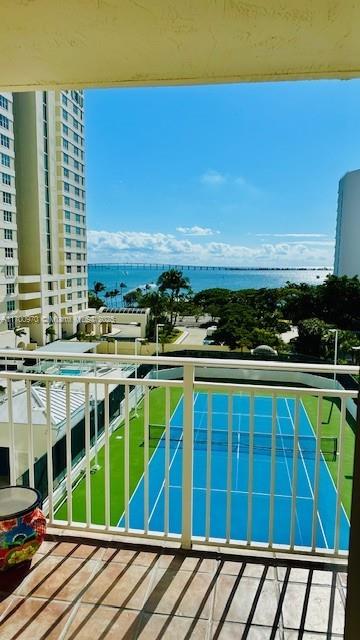 balcony featuring a water view