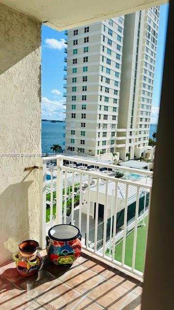 balcony featuring a water view