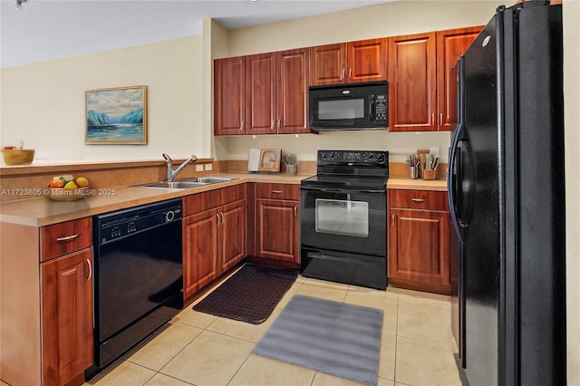 kitchen featuring light tile patterned flooring, sink, and black appliances