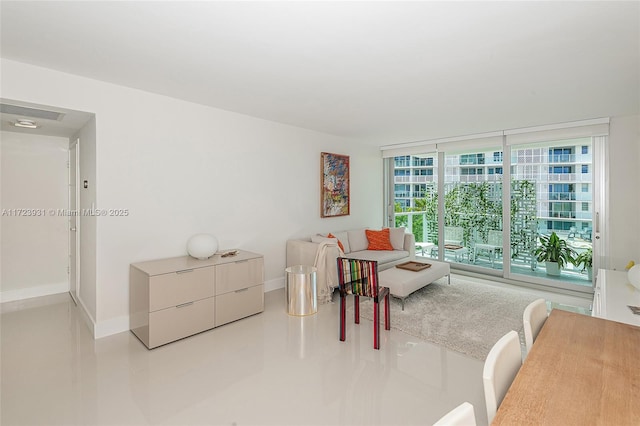 living room with floor to ceiling windows