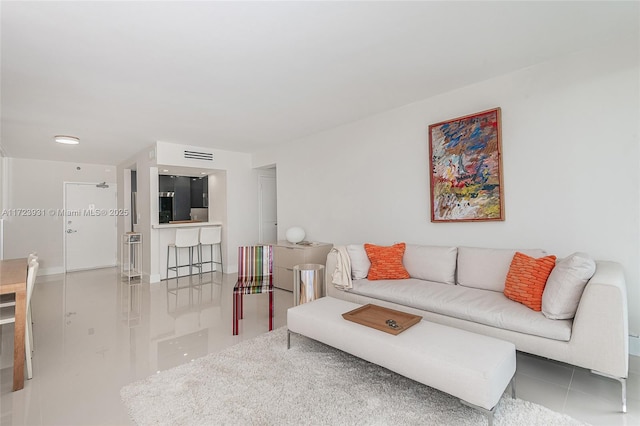 living room featuring tile patterned flooring