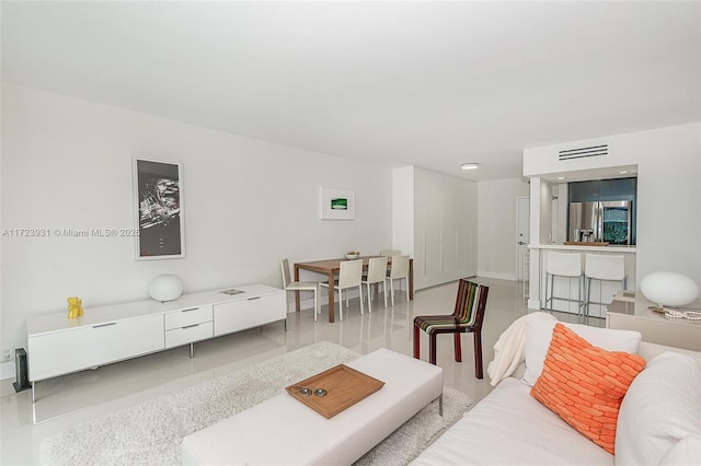 living room featuring tile patterned flooring