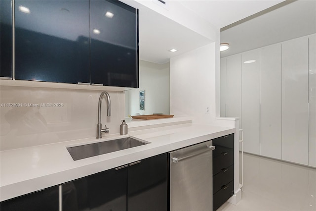 kitchen with white cabinets, dishwasher, and sink