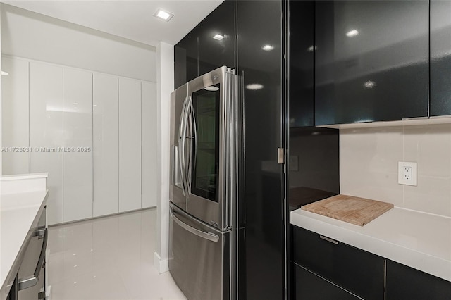 kitchen featuring stainless steel refrigerator with ice dispenser