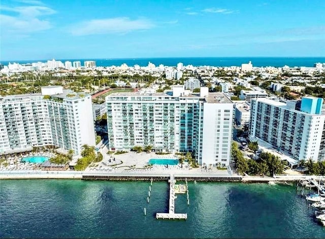 birds eye view of property featuring a water view