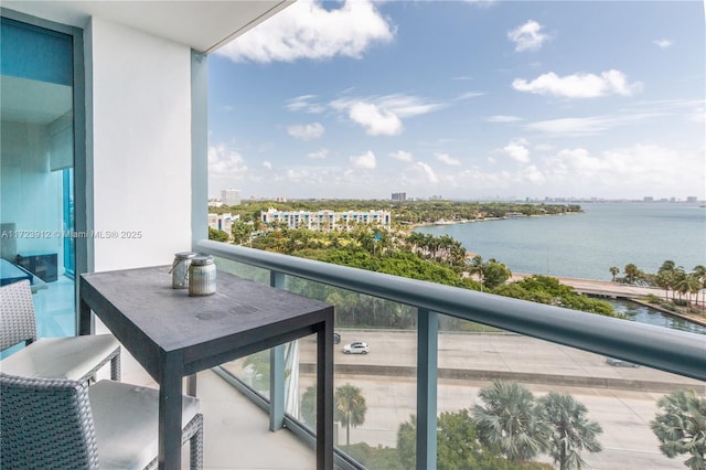 balcony featuring a water view