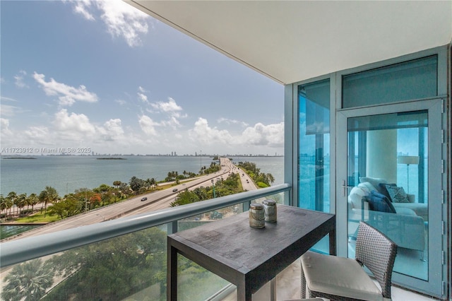 balcony featuring a water view