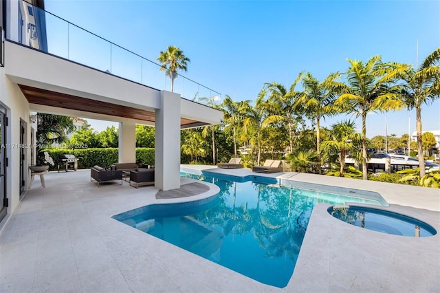 view of pool with outdoor lounge area, an in ground hot tub, and a patio