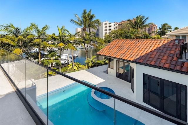 view of pool with a water view