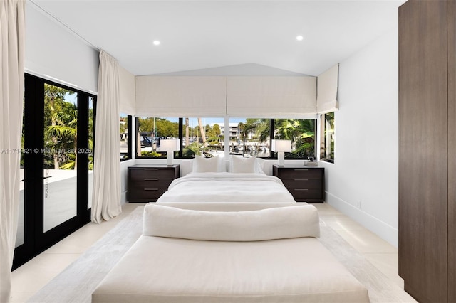 tiled bedroom with access to exterior and vaulted ceiling