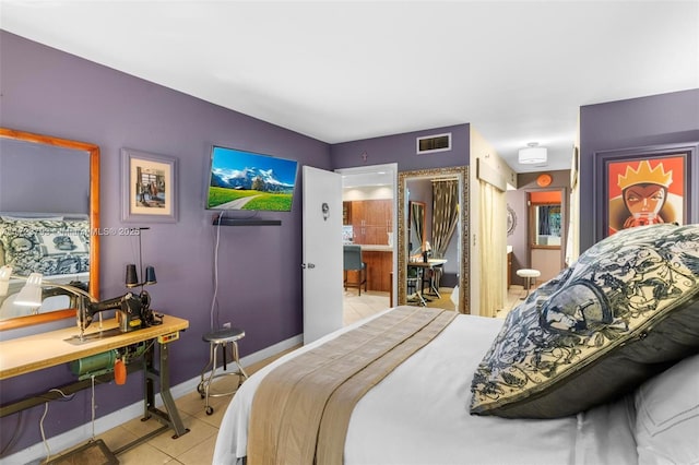 bedroom featuring light tile patterned flooring