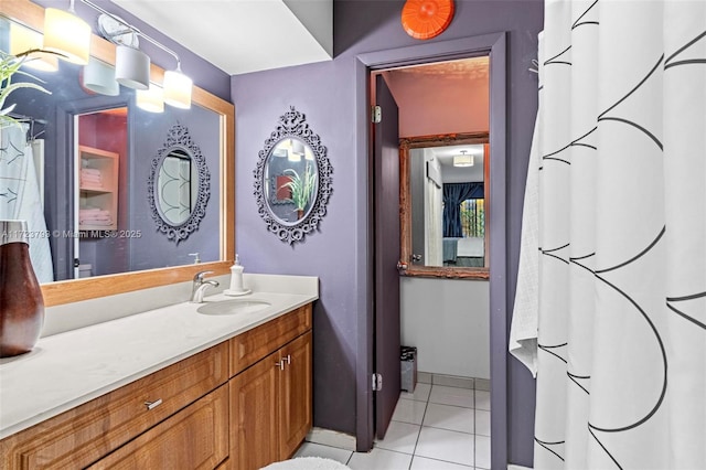 bathroom with tile patterned floors and vanity