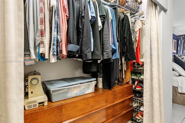 spacious closet featuring light tile patterned floors