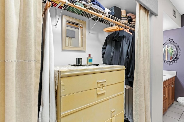 walk in closet featuring light tile patterned floors