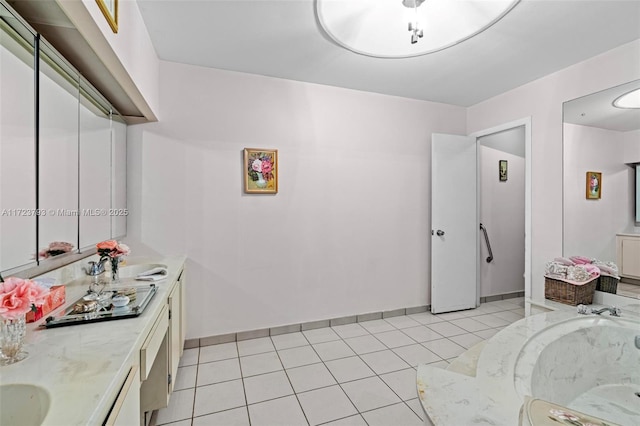 interior space featuring sink and light tile patterned flooring