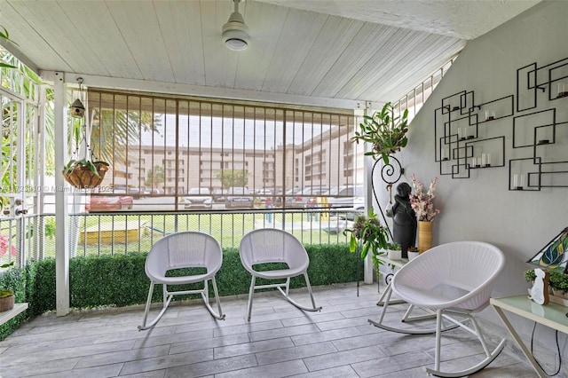 sunroom with wood ceiling and a healthy amount of sunlight