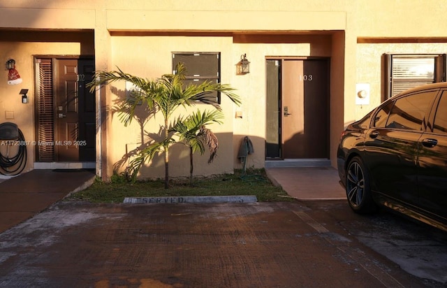 6850 NW 173rd Dr Unit 103, Hialeah, FL 33015 - entrance to property with stucco siding