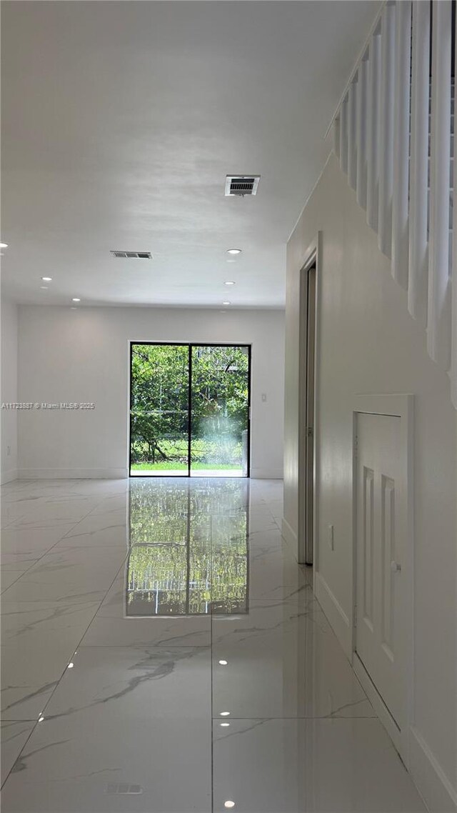 6850 NW 173rd Dr Unit 103, Hialeah, FL 33015 - empty room with light marble finish flooring and recessed lighting